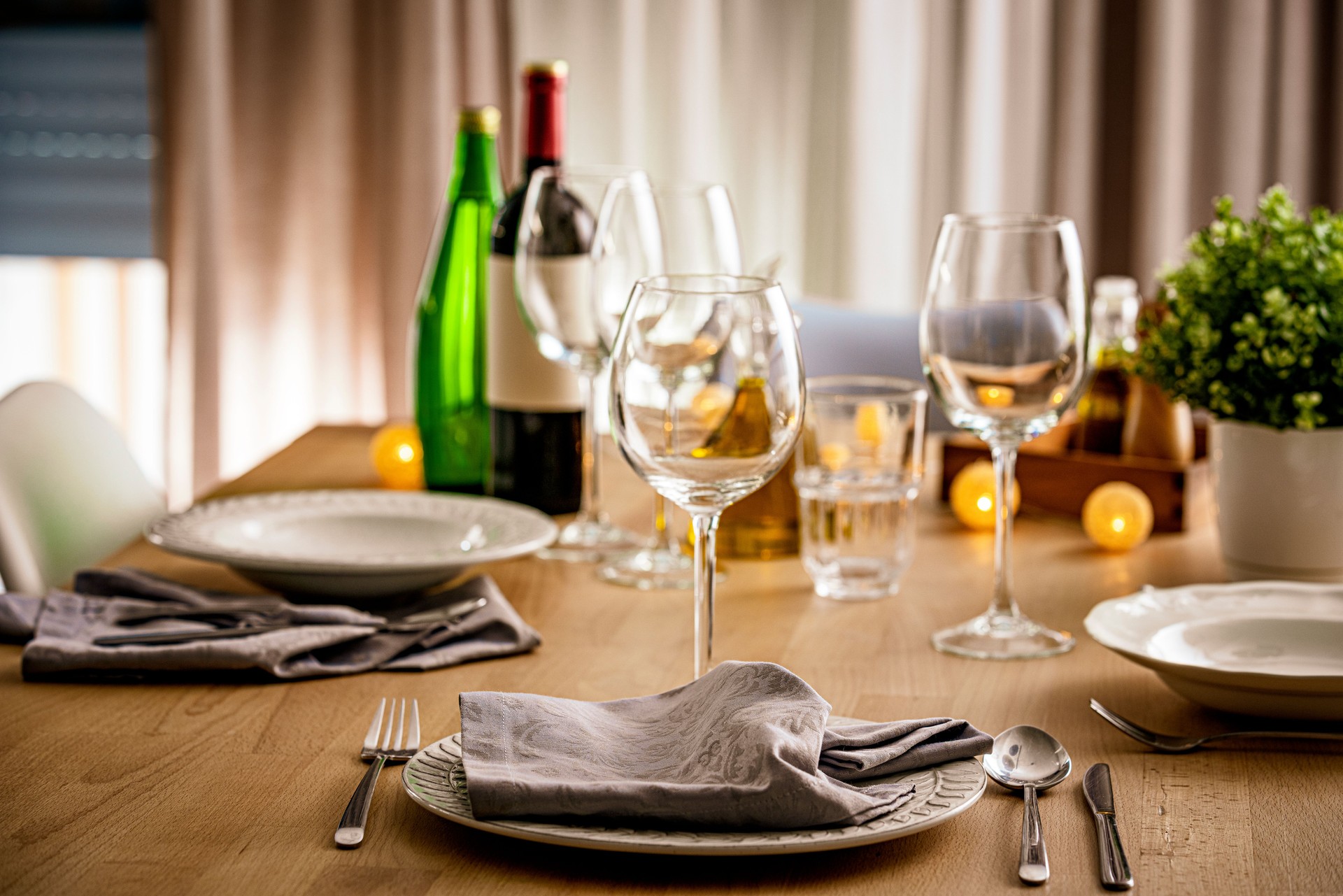 Fine restaurant table with place setting and wine glasses ready for a party